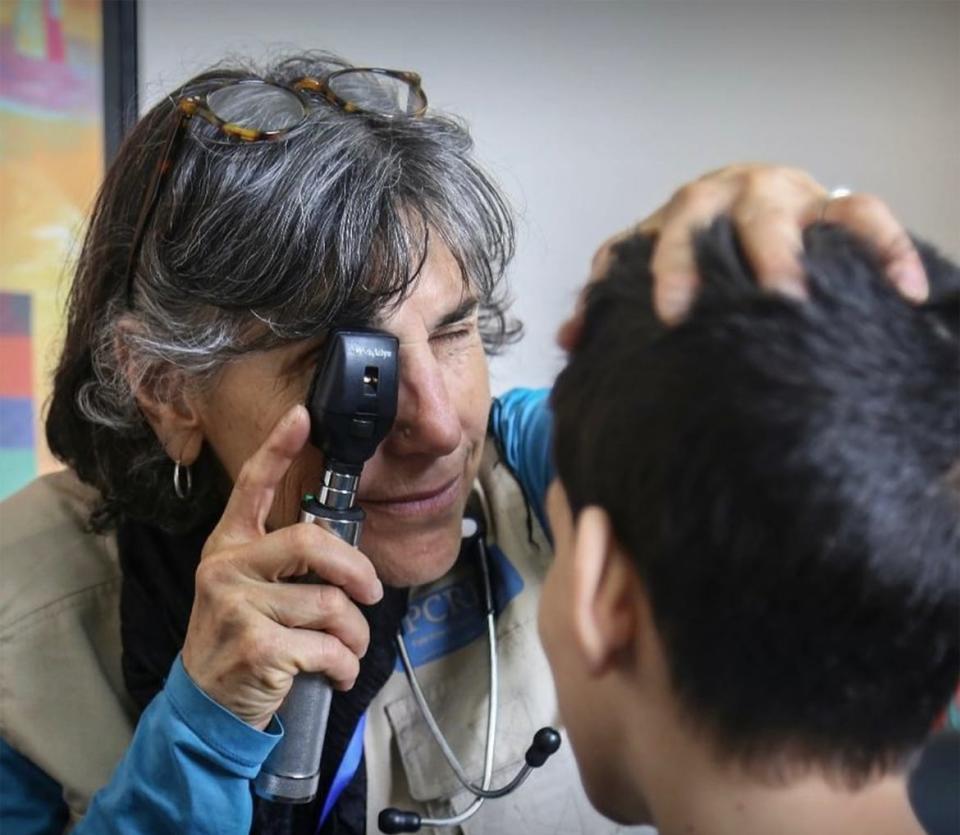 Dr. Barbard Zind working with a patient.