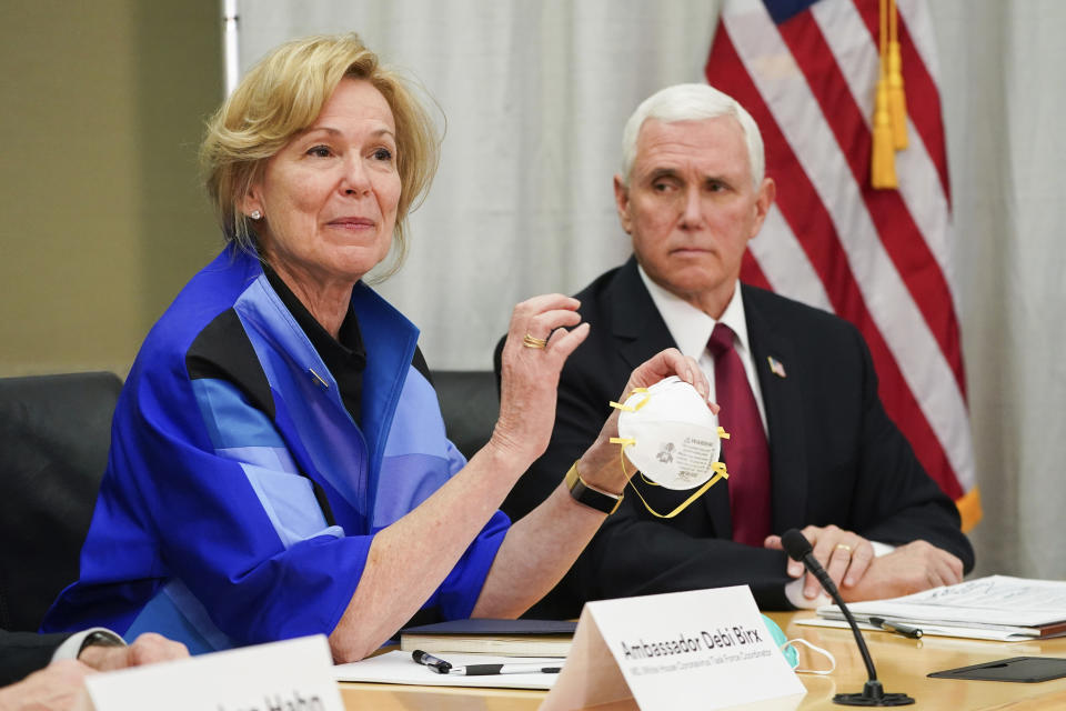 FILE - In this March 5, 2020, file photo, Dr. Deborah Birx, Ambassador and White House coronavirus response coordinator, holds a 3M N95 mask as Vice President Mike Pence visits 3M headquarters in Maplewood, Minn., in a meeting with 3M leaders and Minnesota Gov. Tim Walz to coordinate response to the COVID-19 virus. (Glen Stubbe/Star Tribune via AP, File)