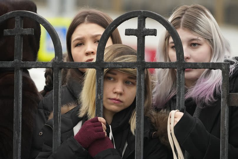 People gather outside the Church of the Icon of the Mother of God Soothe My Sorrows, in Moscow, Russia, Friday, March 1, 2024.