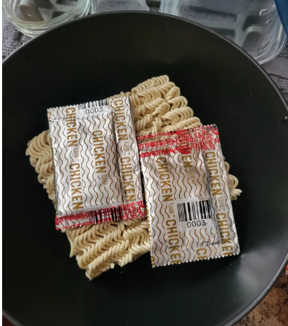 Two packs of seasoning on ramen