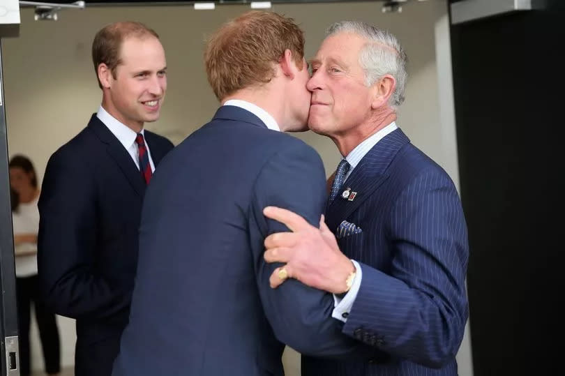 Charles kisses Harry ahead of the Invictus Games Opening Ceremony at Queen Elizabeth II Park on September 10, 2014, in London