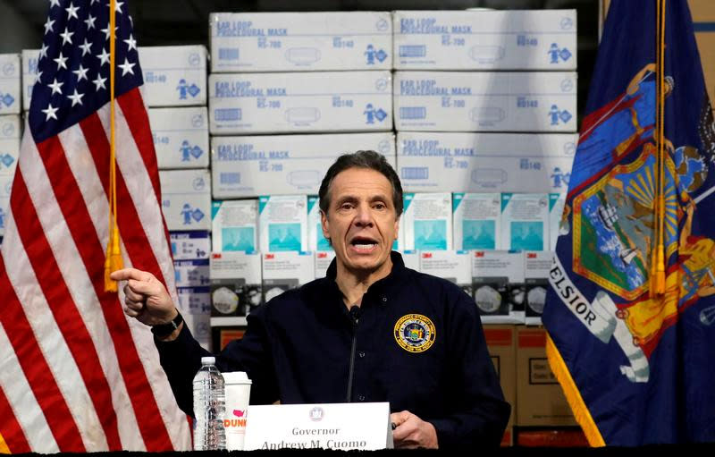 New York Governor Andrew Cuomo speaks in front of stacks of medical protective supplies during a news conference at the Jacob K. Javits Convention Center which will be partially converted into a temporary hospital during the outbreak of the coronavirus disease (COVID-19) in New York City, New York, U.S., March 24, 2020. (Mike Segar/Reuters)