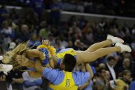 UCLA cheerleaders perform against the Florida during the first half in a regional semifinal game at the NCAA college basketball tournament, Thursday, March 27, 2014, in Memphis, Tenn. (AP Photo/Mark Humphrey)