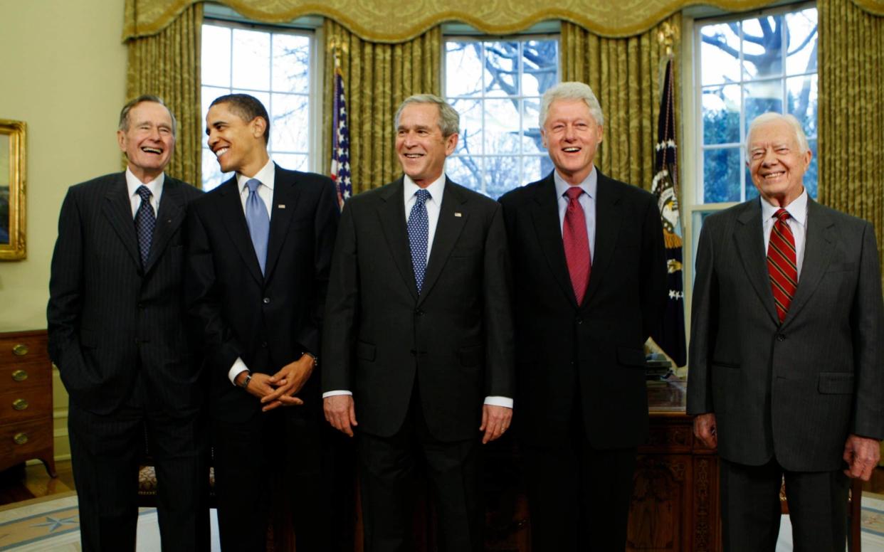 Former presidents George H.W. Bush, Barack Obama, President George W. Bush, Bill Clinton and Jimmy Carter - AP