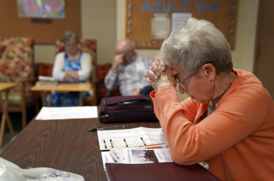 Members of Fern Creek Baptist Church pray during Bible study, Sunday, May 21, 2023, in Louisville, Ky. (AP Photo/Jessie Wardarski)