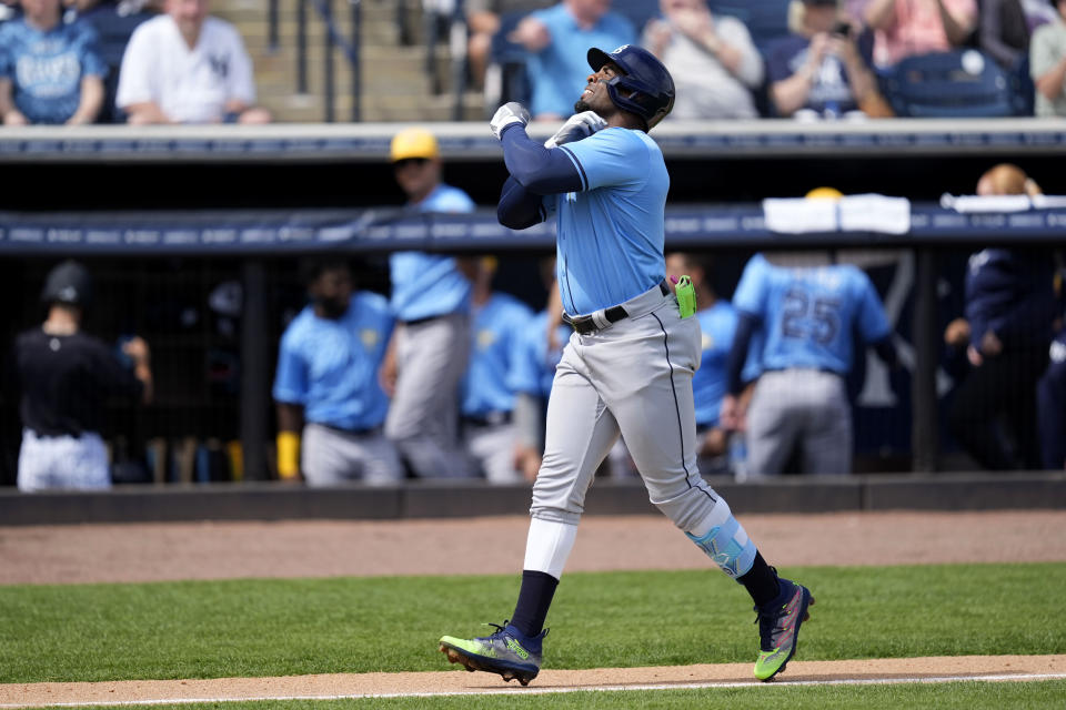 Tampa Bay Rays first baseman Yandy Diaz reacts after his home run in the first inning of a spring training baseball game against the New York Yankees Wednesday, March 6, 2024, in Tampa, Fla. (AP Photo/Charlie Neibergall)