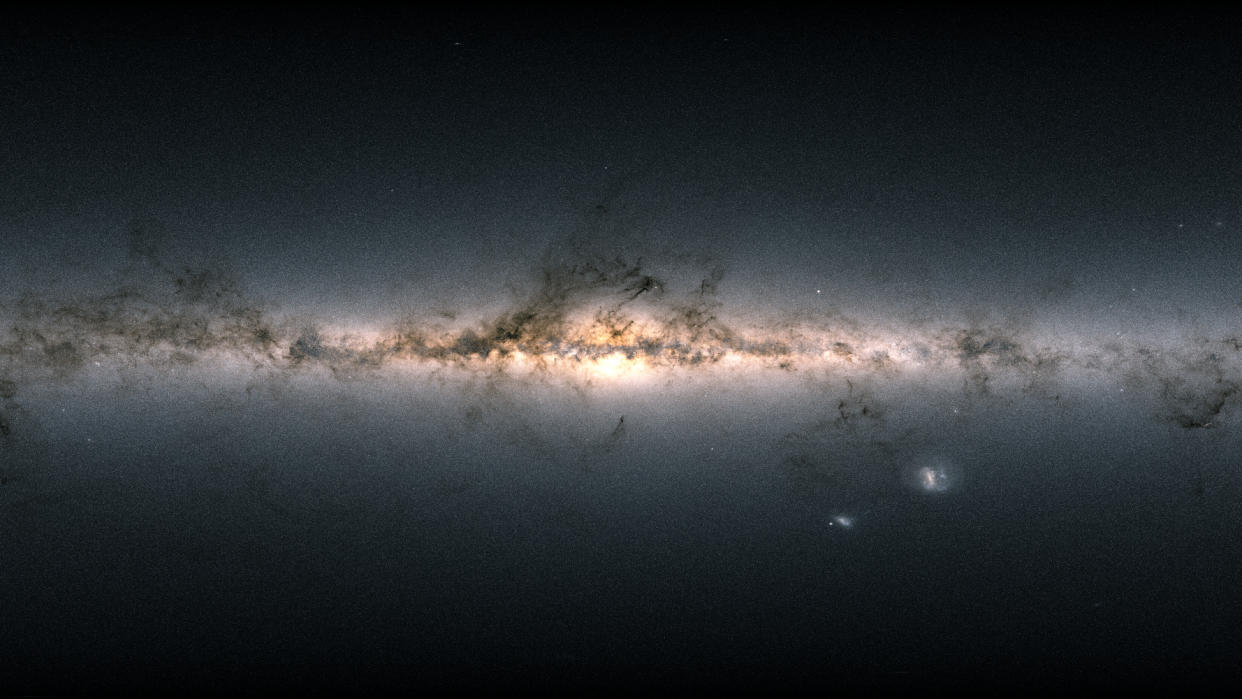  A dark glowing stretch of gases and light that is the milky way galaxy. 