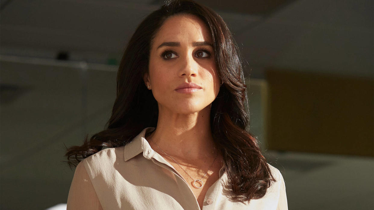  Rachel Zane looks concerned as she looks at someone off-screen in Suits 