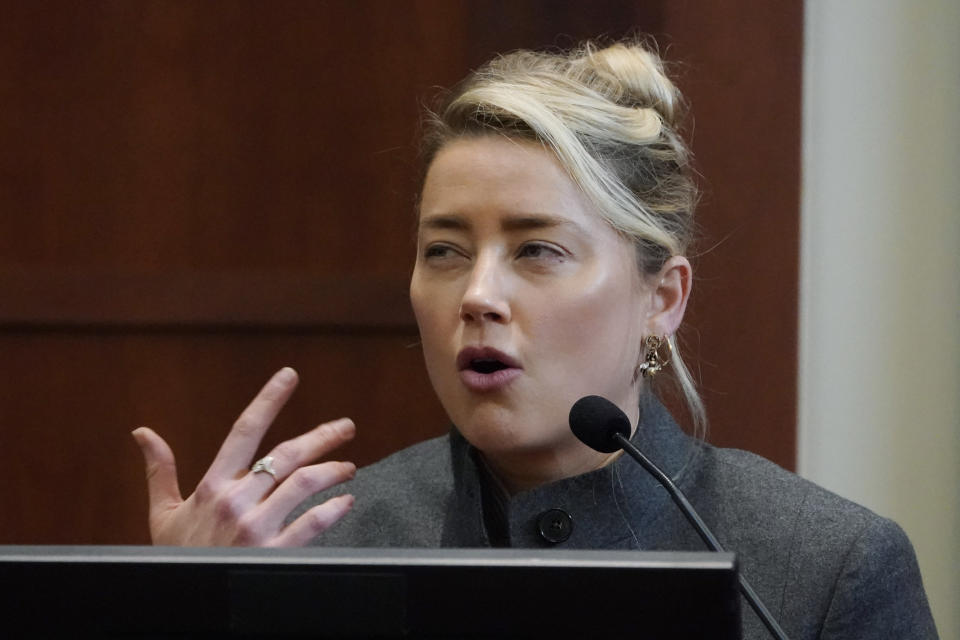 Actor Amber Heard testifies in the courtroom at the Fairfax County Circuit Courthouse in Fairfax, Va., Monday, May 16, 2022. Actor Johnny Depp sued his ex-wife Amber Heard for libel in Fairfax County Circuit Court after she wrote an op-ed piece in The Washington Post in 2018 referring to herself as a "public figure representing domestic abuse." (AP Photo/Steve Helber, Pool)