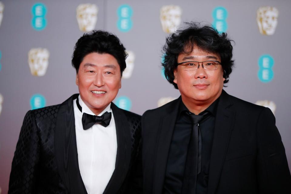 South Korean actor Song Kang Ho and South Korean director Bong Joon-ho pose on the red carpet upon arrival at the BAFTA British Academy Film Awards at the Royal Albert Hall in London on February 2, 2020. (Photo by Tolga AKMEN / AFP) (Photo by TOLGA AKMEN/AFP via Getty Images)