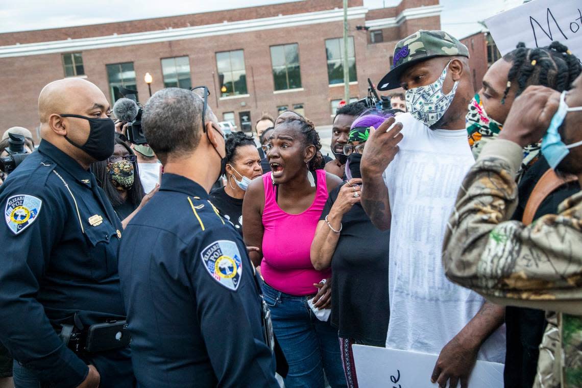 Demonstrators talk with Elizabeth City Police Chief Eddie Buffaloe, Jr. outside the Pasquotank County Public Safety Building in downtown Elizabeth City, NC Wednesday, April 21, 2022. A Pasquotank County sheriff’s deputy shot and killed Andrew Brown Jr., who is Black, on April 21, 2021 in Elizabeth City, North Carolina. Officials say they were executing a search warrant about 8:30 a.m. on Perry Street. The shooting is under review by the State Bureau of Investigation.