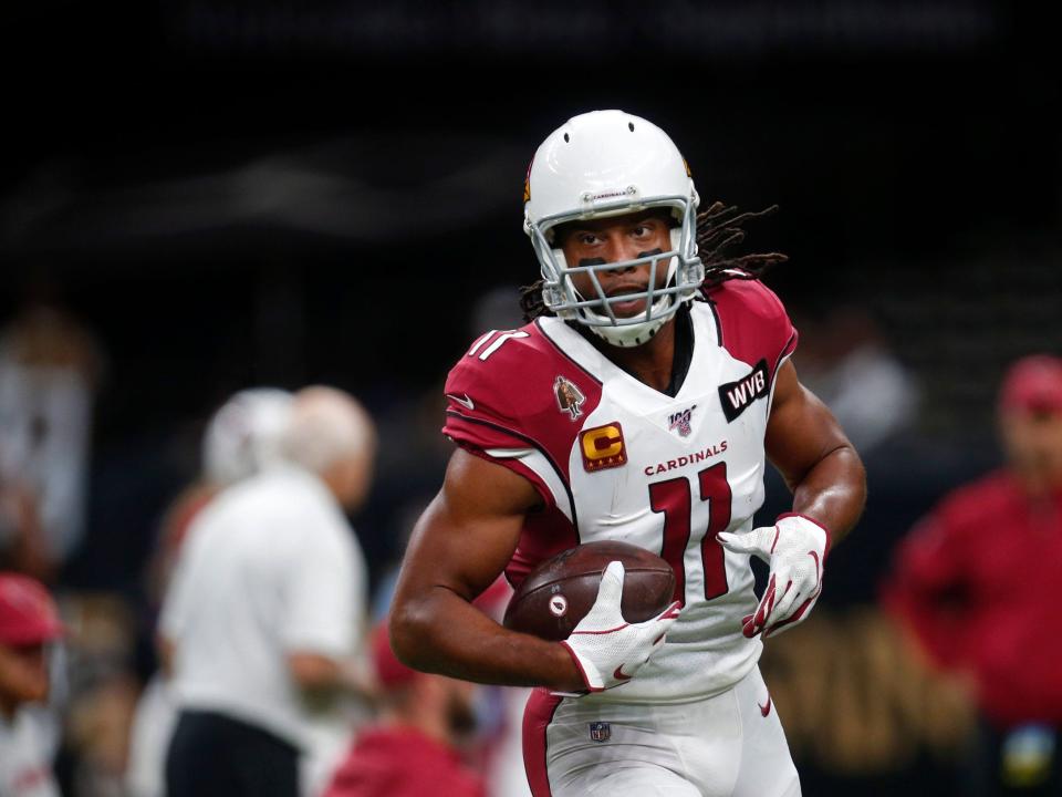 Larry Fitzgerald warms up ahead of a game against the New Orleans Saints.