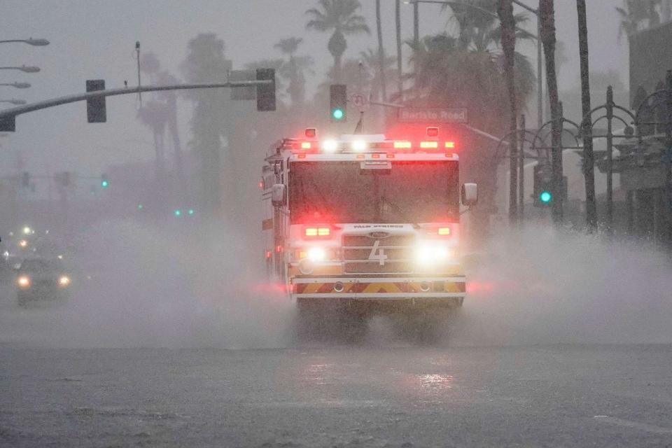 PHOTO: A fire engine responds to a call through standing water on Indian Canyon Drive as Tropical Storm Hilary approaches Palm Springs, California, U.S., August 20, 2023. (Bryan Woolston/Reuters)