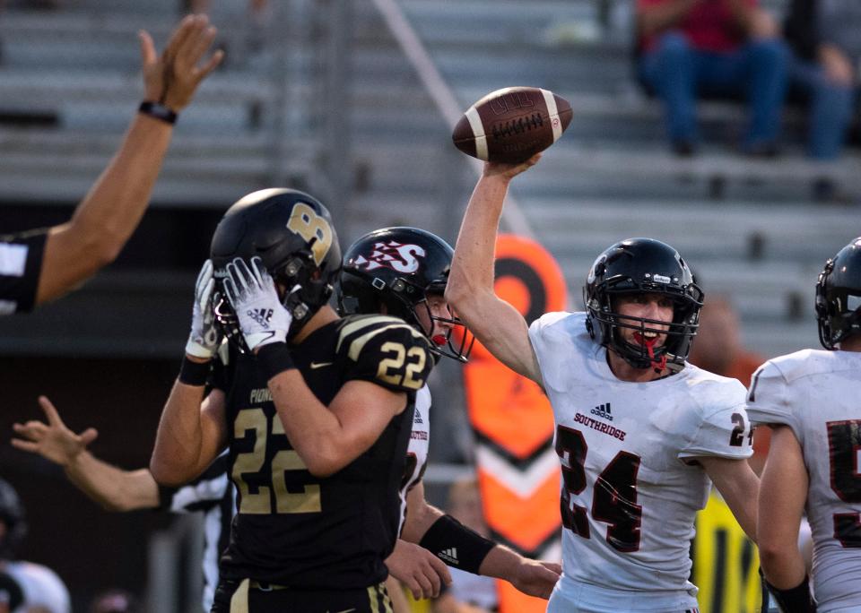 Southridge's Myles Kerkhoff (24) celebrates recovering Boonville’s Reece Wilder's (22) turnover during their game at Bennett Field in Boonville, Ind., Friday night, Aug. 26, 2022. Southridge beat Boonville in a hot and humid dogfight 13-0.