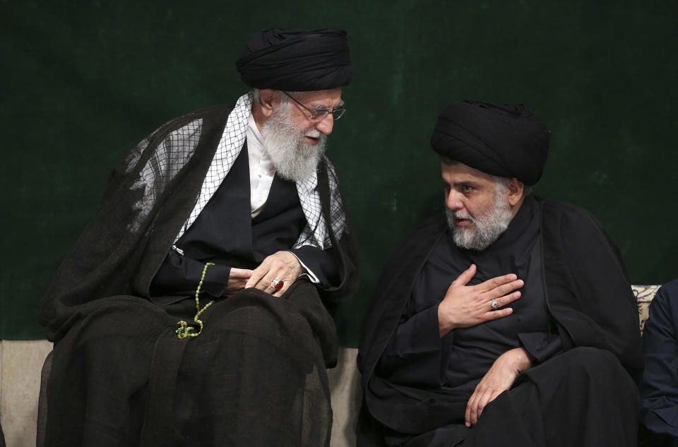 In this picture released by the official website of the office of the Iranian supreme leader, Supreme Leader Ayatollah Ali Khamenei, left, greets Iraqi Shiite cleric Muqtada al-Sadr during a mourning ceremony commemorating Ashoura, the death anniversary of Hussein, the grandson of Prophet Muhammad, in Tehran, Iran, Tuesday, Sept. 10, 2019. Shiite Muslims around the world are observing Ashoura, one of the most sacred religious holy days for their sect, which commemorates the death of Hussein, at the Battle of Karbala in present-day Iraq in the 7th century. (Office of the Iranian Supreme Leader via AP)