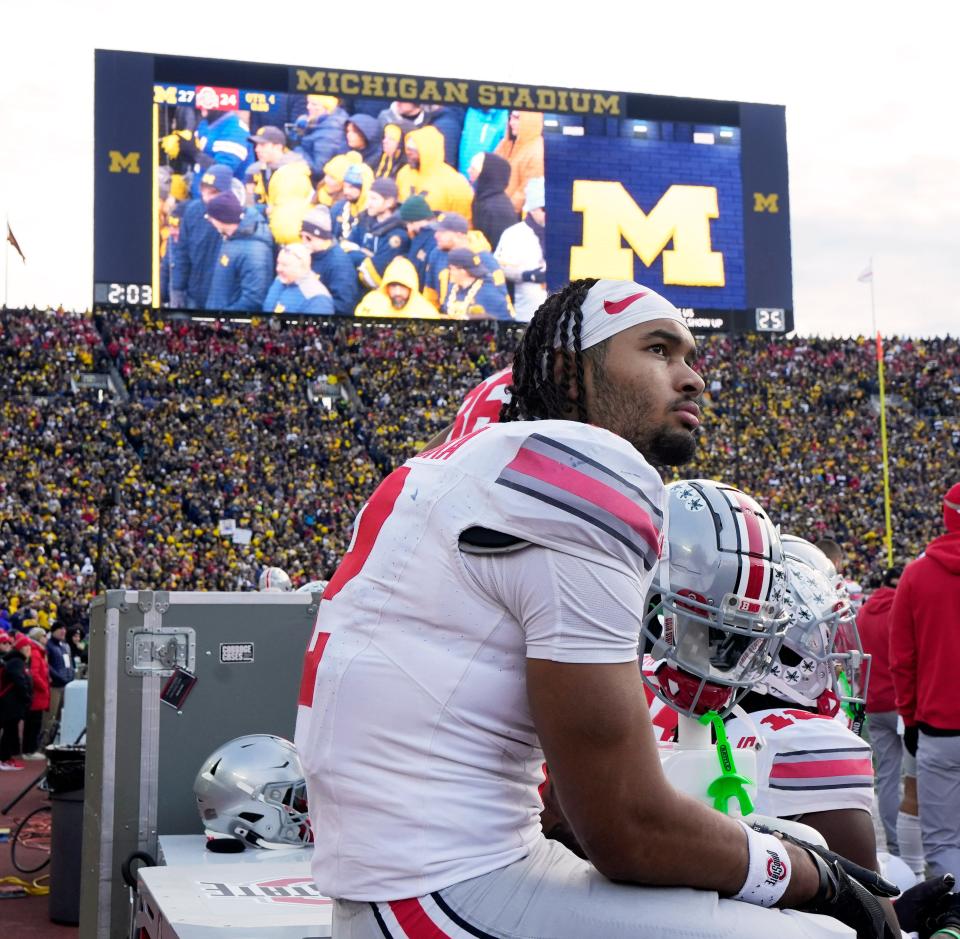 Ohio State receiver Emeka Ekuba sits on the bench near the end of Saturday's loss at Michigan.