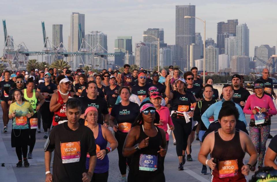 Runners make their way towards the 5th Street exit on the MacArthur Causeway during the 18th annual Life Time Miami Marathon and Half Marathon where runners took off in the dark at 6 a.m. Sunday, February 9, 2020 in front of AmericanAirlines Arena and finished on Biscayne Boulevard near Bayfront Park. There were more than 20,000 combined runners registered for the marathon and half marathon.