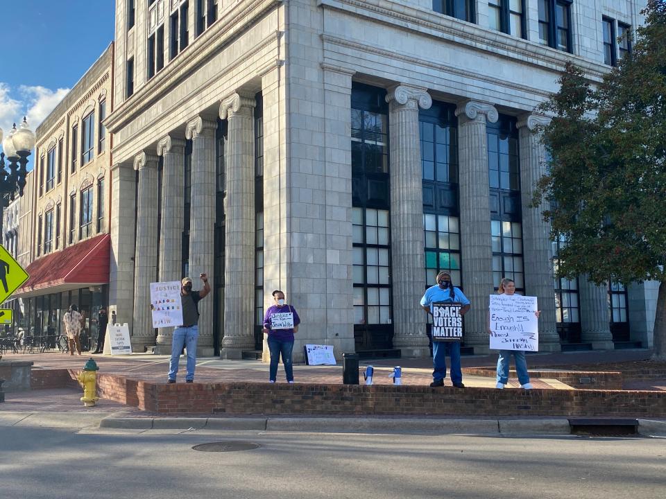 Pictured from left: Shaun McMillan, Kathy Greggs, Chilleko Hurst, and Rhonda Shirley met in front of the Market House Thursday, March 17, 2022, to continue justice for Jason Walker demonstrations.