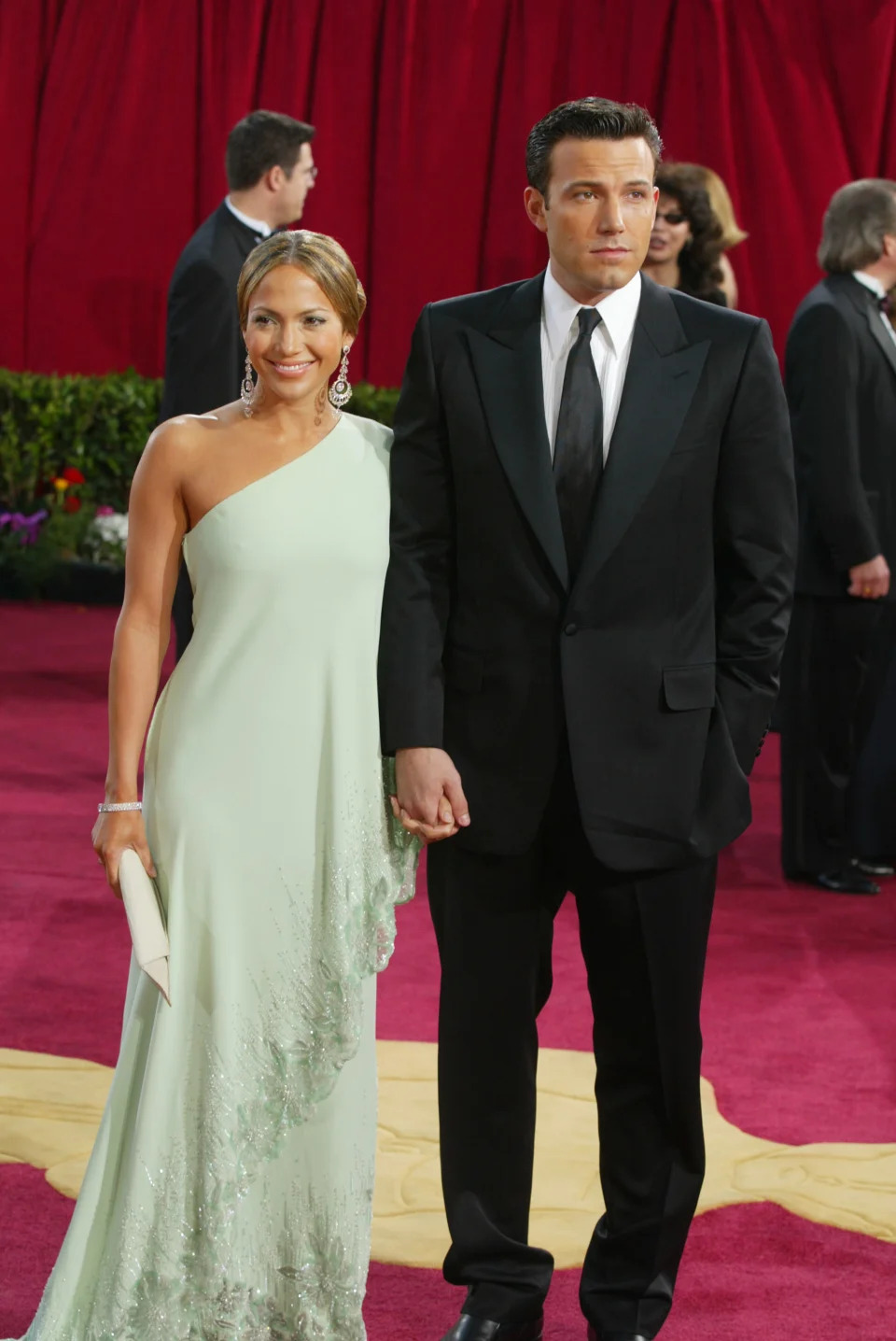 HOLLYWOOD - MARCH 23: Actress Jennifer Lopez, wearing Harry Winston jewelry, and actor Ben Affleck attend the 75th Annual Academy Awards at the Kodak Theater on March 23, 2003 in Hollywood, California. (Photo by Kevin Winter/Getty Images)