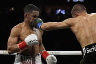Eimantas Stanionis lands a left to Gabriel Maestre in a welterweight title fight Saturday, May 4, 2024, in Las Vegas. (AP Photo/John Locher)