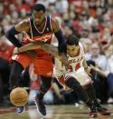 Washington Wizards guard John Wall, left, steals the ball from Chicago Bulls guard D.J. Augustin during the first half in Game 1 of an opening-round NBA basketball playoff series in Chicago, Sunday, April 20, 2014. (AP Photo/Nam Y. Huh)