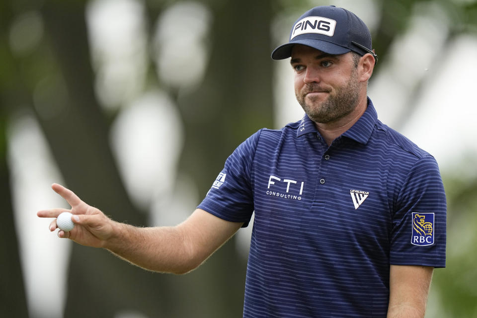 Corey Conners, of Canada, waves after his putt on the fourth hole during the second round of the PGA Championship golf tournament at Oak Hill Country Club on Friday, May 19, 2023, in Pittsford, N.Y. (AP Photo/Eric Gay)