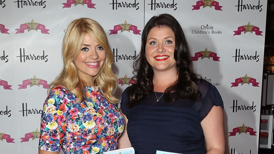 A photo of Holly and Kelly Willoughby holding their books 