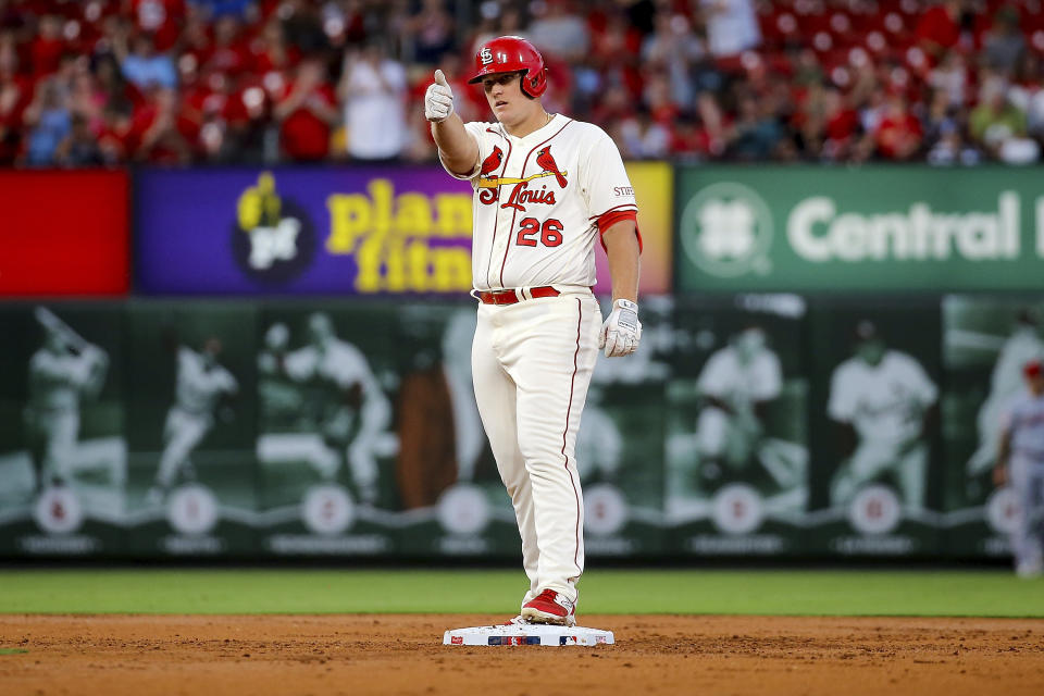 St. Louis Cardinals' Luken Baker gestures toward the dugout after hitting a two-run double against the Cincinnati Reds during the first inning of a baseball game Saturday, Sept. 30, 2023, in St. Louis. (AP Photo/Scott Kane)