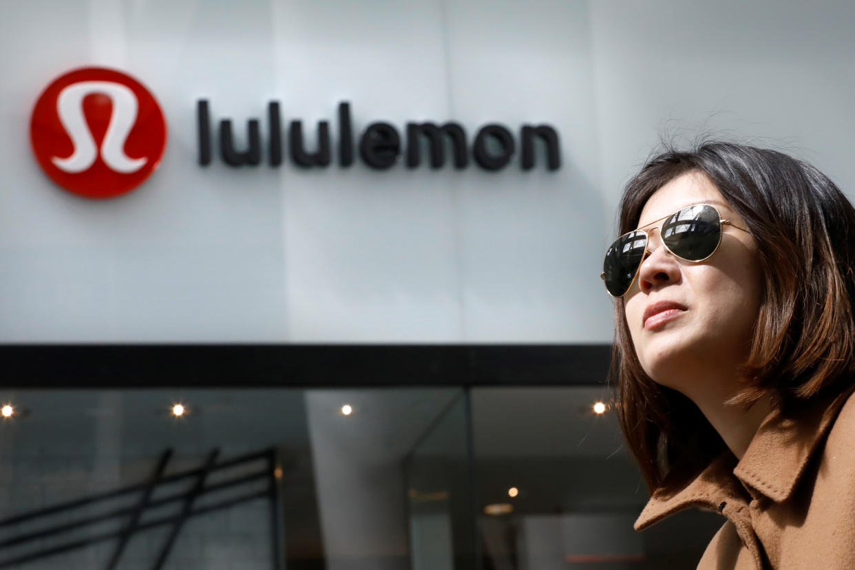 A woman passes by a Lululemon Athletica real store in New York City, U.S., March 30, 2017. REUTERS/Brendan McDermid