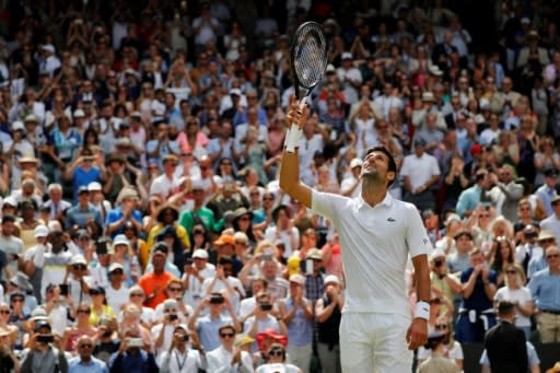 King and his court: Novak Djokovic celebrates after beating Philipp Kohlschreiber