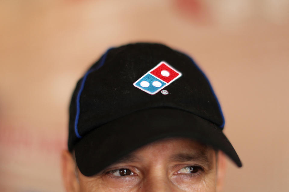 File photo: Domino's Pizza employees work at a restaurant in Los Angeles, California, USA on July 18, 2018.Reuters/Lucy Nicholson/File Photo