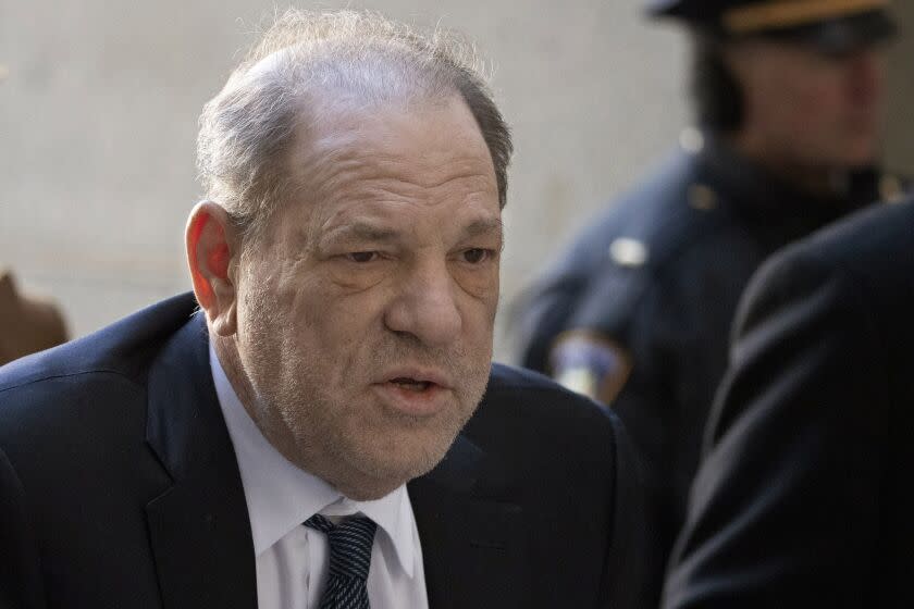FILE - Harvey Weinstein arrives at a Manhattan court in New York, as jury deliberations continue in his rape trial, Feb. 21, 2020. British prosecutors say they have authorized police to charge ex-film producer Harvey Weinstein with two counts of indecent assault against a woman in London in 1996. The Crown Prosecution Service said in a statement "charges have been authorized" against Weinstein, 70, following a review of evidence gathered by London's Metropolitan Police in its investigation. (AP Photo/Mark Lennihan, File)