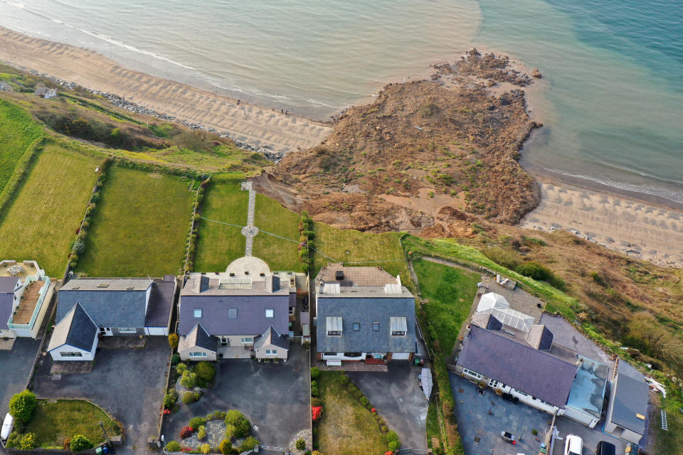 NEFYN, WALES - APRIL 21: In an aerial view houses are seen next to the cliff edge after a landslide at Nefyn Beach in Gwynedd, North Wales on April 21, 2021 in Nefyn, United Kingdom. Following the large land slip people were advised to temporarily relocate. (Photo by Christopher Furlong/Getty Images)