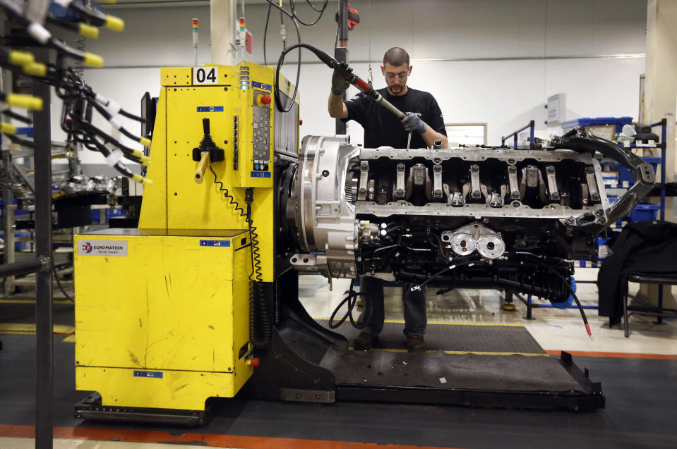 In this March 26, 2014 picture, Jon Wyand works on a truck engine assembly line at Volvo Trucks' powertrain manufacturing facility in Hagerstown, Md. The Commerce Department releases first-quarter gross domestic product on Wednesday, April 30, 2014. (AP Photo/Patrick Semansky)