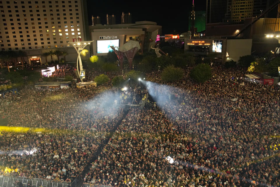 FILE - Fans fill the plaza in front of the T-Mobile Arena during a rally after a parade along the Las Vegas Strip for the NHL hockey champions, June 17, 2023, in Las Vegas. Judges in Las Vegas ordered a man accused of threatening mass violence at the parade celebrating the Golden Knights victory in the NHL Stanley Cup championship to remain jailed unless he can post $55,000 bail. Anthony Zuccaro appeared in court Wednesday, June 21, 2023 in separate cases alleging he damaged Nevada State Police vehicles with his motorcycle and threatened to either drive a truck into throngs of hockey fans or use gasoline bombs to injure police and revelers on the Las Vegas Strip. (AP Photo/John Locher, file)