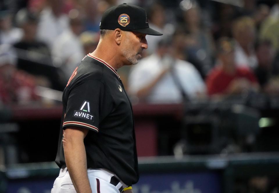 Arizona Diamondbacks head coach Torey Lovullo walks off the field after being tossed by the umpire for arguing a call against the Milwaukee Brewers at Chase Field in Phoenix on April 12, 2023.