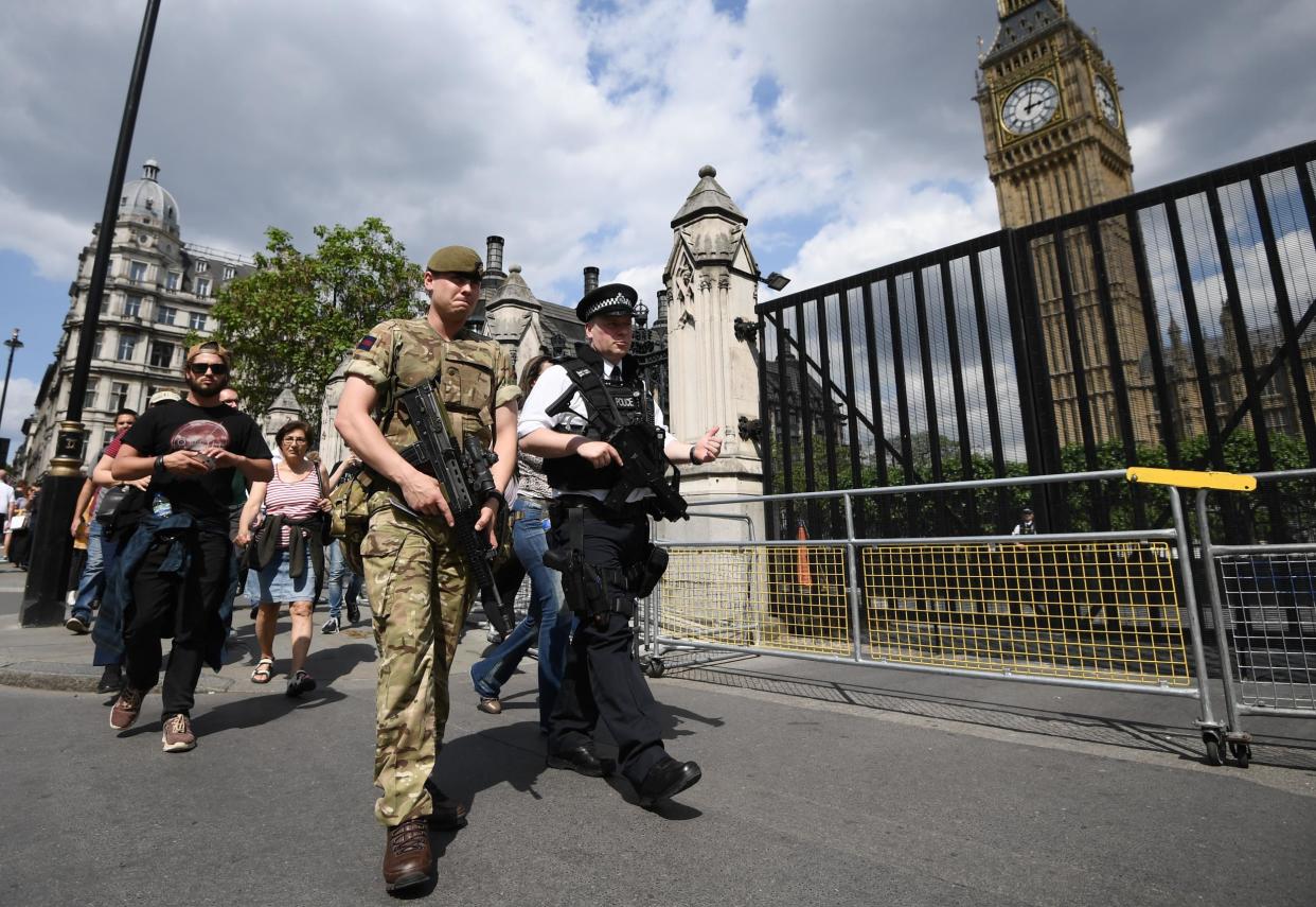 Soldiers reinforce police outside the Palace of Westminster in London: Getty