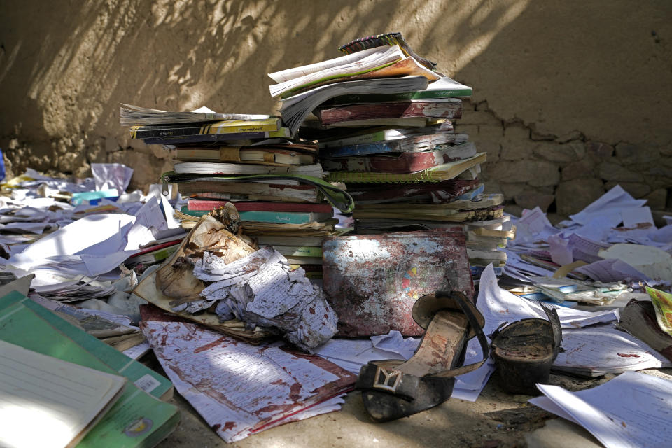 A view of the bloody books and supplies that left from Friday's suicide bomber attack on a Hazara education center, Kabul, Afghanistan, Saturday, Oct. 1, 2022. Afghanistan's Hazaras, who are mostly Shiite Muslims, have been the target of a brutal campaign of violence for the past several years. (AP Photo/Ebrahim Noroozi)