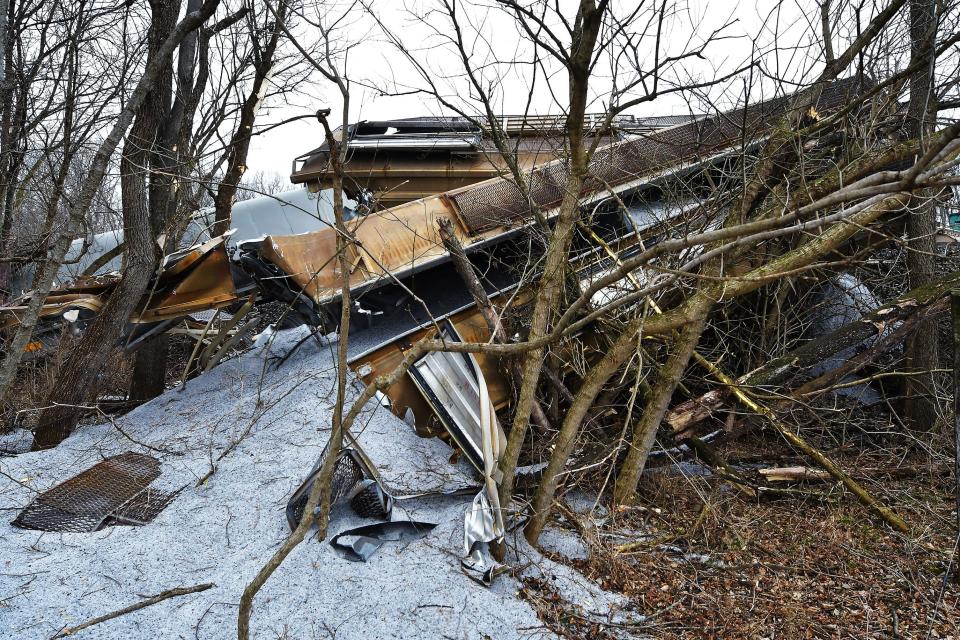 Rock salt and mangled rail cars are shown Thursday after a train derailment Wednesday evening near Sharpsburg. The train was operated by Norfolk Southern.