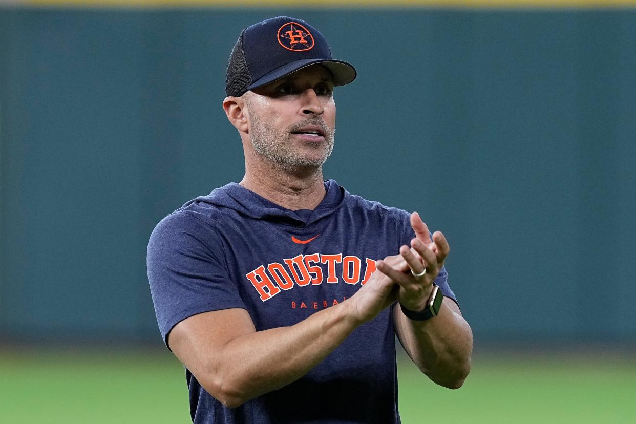 Houston Astros bench coach Joe Espada talks with players before a baseball game against the Tampa Bay Rays, Friday, July 28, 2023, in Houston.