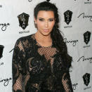 Pregnant <b>Kim Kardashian's fishtail plait</b> shows a styled 'do doesn't have to be overdone ©Rex