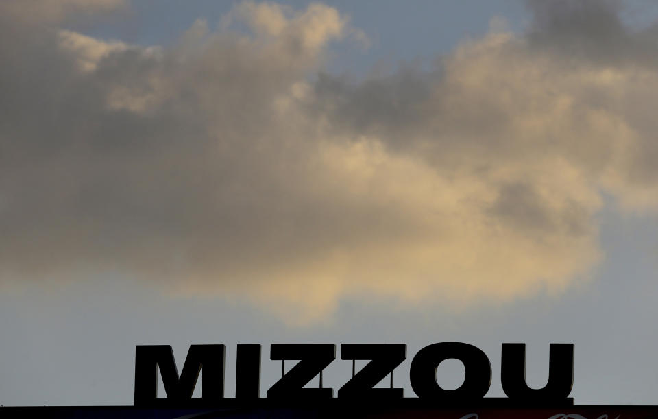 In this Nov. 2, 2013, file photo, the Mizzou logo is seen on a scoreboard over Memorial Stadium at Faurot Field before the start of an NCAA college football game between Missouri and Tennessee in Columbia, Mo. The NCAA has sanctioned Missouri's football, baseball and softball programs on Thursday, Jan. 31, 2019, after an investigation revealed academic misconduct involving a tutor who completed coursework for athletes. (AP Photo/Jeff Roberson, File)