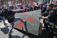 <p>White nationalists, neo-Nazis and members of the ‘alt-right’ clash with counter-protesters as they enter Lee Park during the ‘Unite the Right’ rally August 12, 2017 in Charlottesville, Virginia. After clashes with anti-fascist protesters and police the rally was declared an unlawful gathering and people were forced out of Lee Park, where a statue of Confederate General Robert E. Lee is slated to be removed. (Photo: Chip Somodevilla/Getty Images) </p>