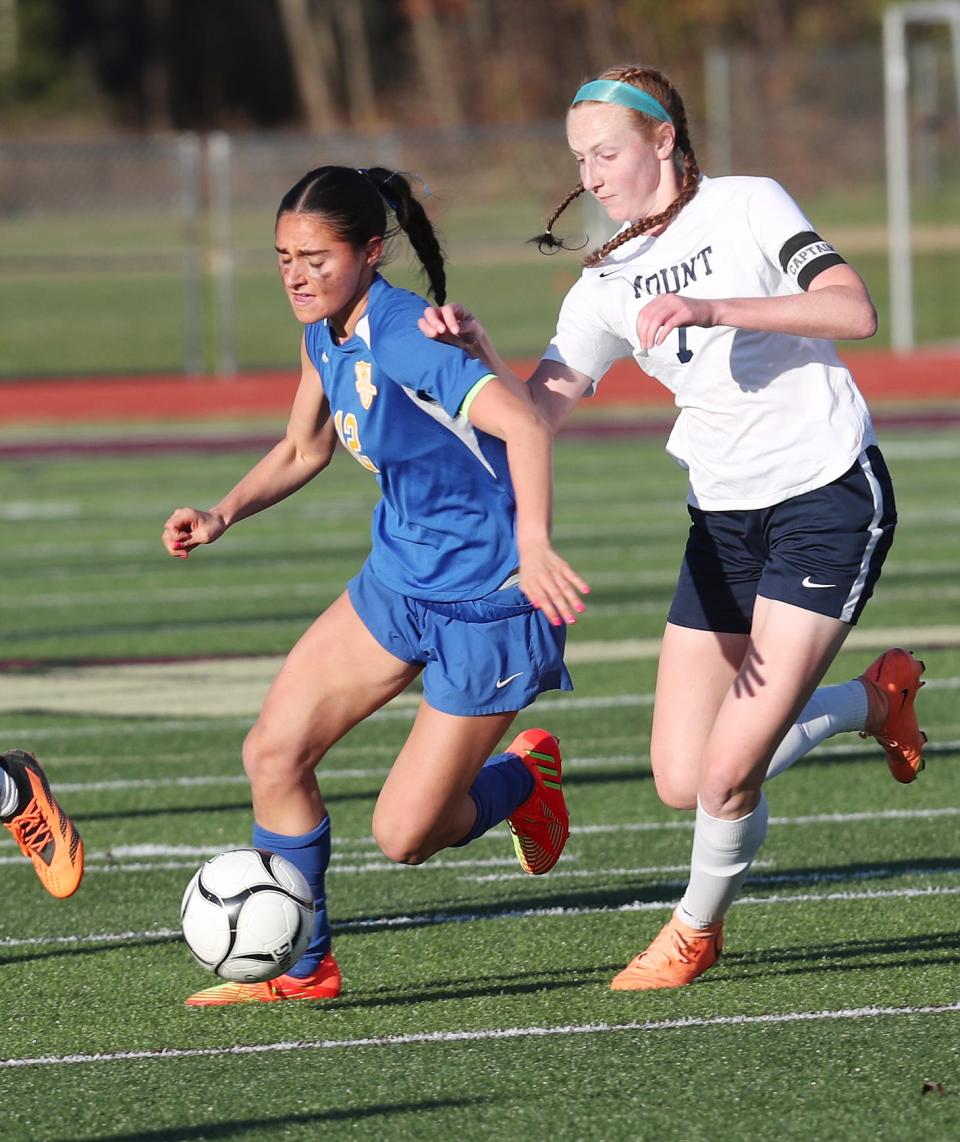 From left, North Salem's Cassandra Pelosi (12) tries to get around Mount Academy's Kayley Huleatt (7) during girls soccer regional playoff at Arlington High School in Freedom Plains Nov. 2, 2023. Mount won the game 3-0.