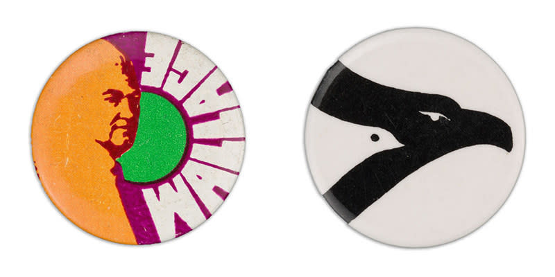 A button shows a psychedelic portrait of George Wallace with the word "Wallace", the button on the right shows a large black bird's profile, with a smaller white bird's profile inside its frame