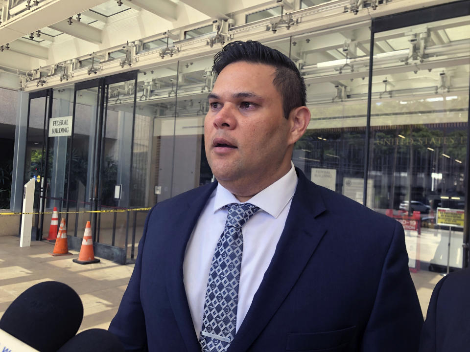 Former state Rep. Ty Cullen speaks to reporters outside U.S. District Court in Honolulu on Thursday, April 6, 2023 after he was sentenced to two years in prison for taking bribes in exchange for influencing cesspool legislation. Cullen's federal corruption case has drawn attention to a perennial problem in the islands: the tens of thousands of cesspools that release 50 million gallons of raw sewage into the state's pristine waters every day.(AP Photo/Audrey McAvoy)