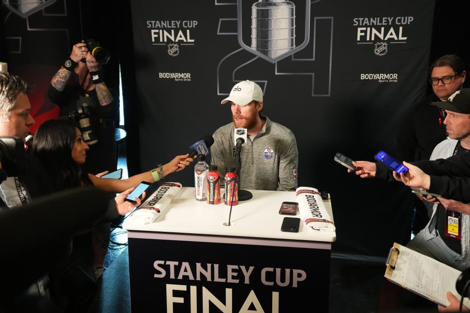 Jun 7, 2024; Sunrise, Florida, USA; Edmonton Oilers center Connor McDavid (97) takes questions during media day in advance of the 2024 Stanley Cup Final at Amerant Bank Arena. Mandatory Credit: Jim Rassol-USA TODAY Sports