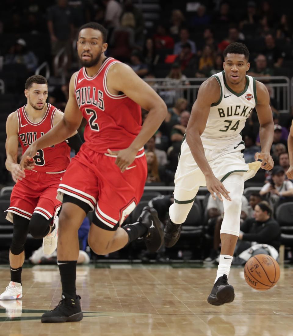 Milwaukee Bucks' Giannis Antetokounmpo tries to drive past Chicago Bulls' Jabari Parker during the second half of an NBA preseason basketball game Wednesday, Oct. 3, 2018, in Milwaukee. (AP Photo/Morry Gash)