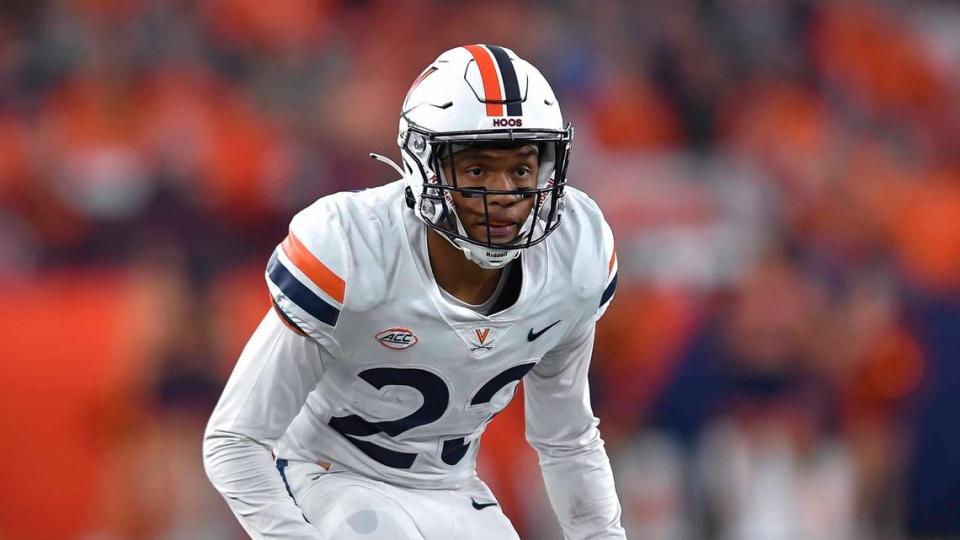 Virginia cornerback Fentrell Cypress II (23) runs on the field during the second half of an NCAA college football game against Syracuse on Friday, Sept. 23, 2022 in Syracuse, N.Y. (AP Photo/Adrian Kraus)