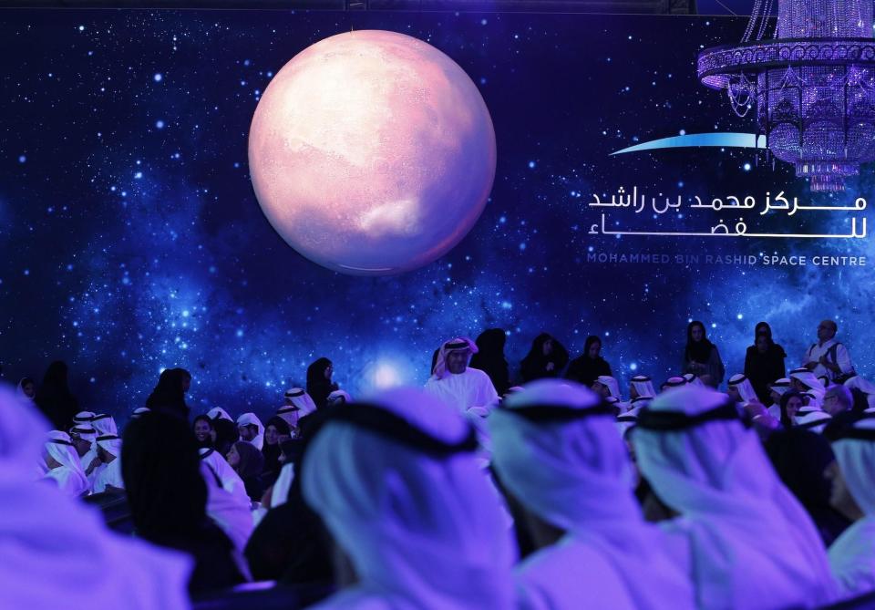 United Arab Emirates (UAE) officials, engineers and scientists take part in a ceremony to unveil UAE's Mars Mission on May 6, 2015 in Dubai: KARIM SAHIB/AFP via Getty Images